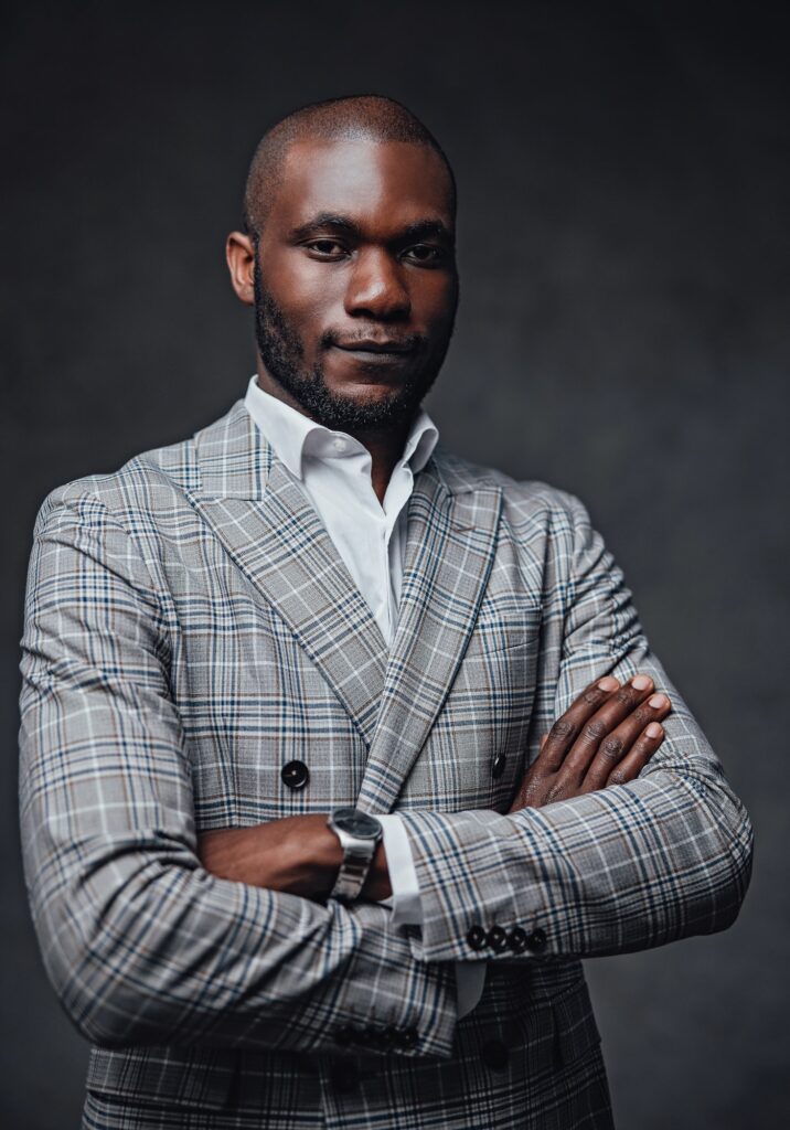 Well-dressed african business big shot looking at camera